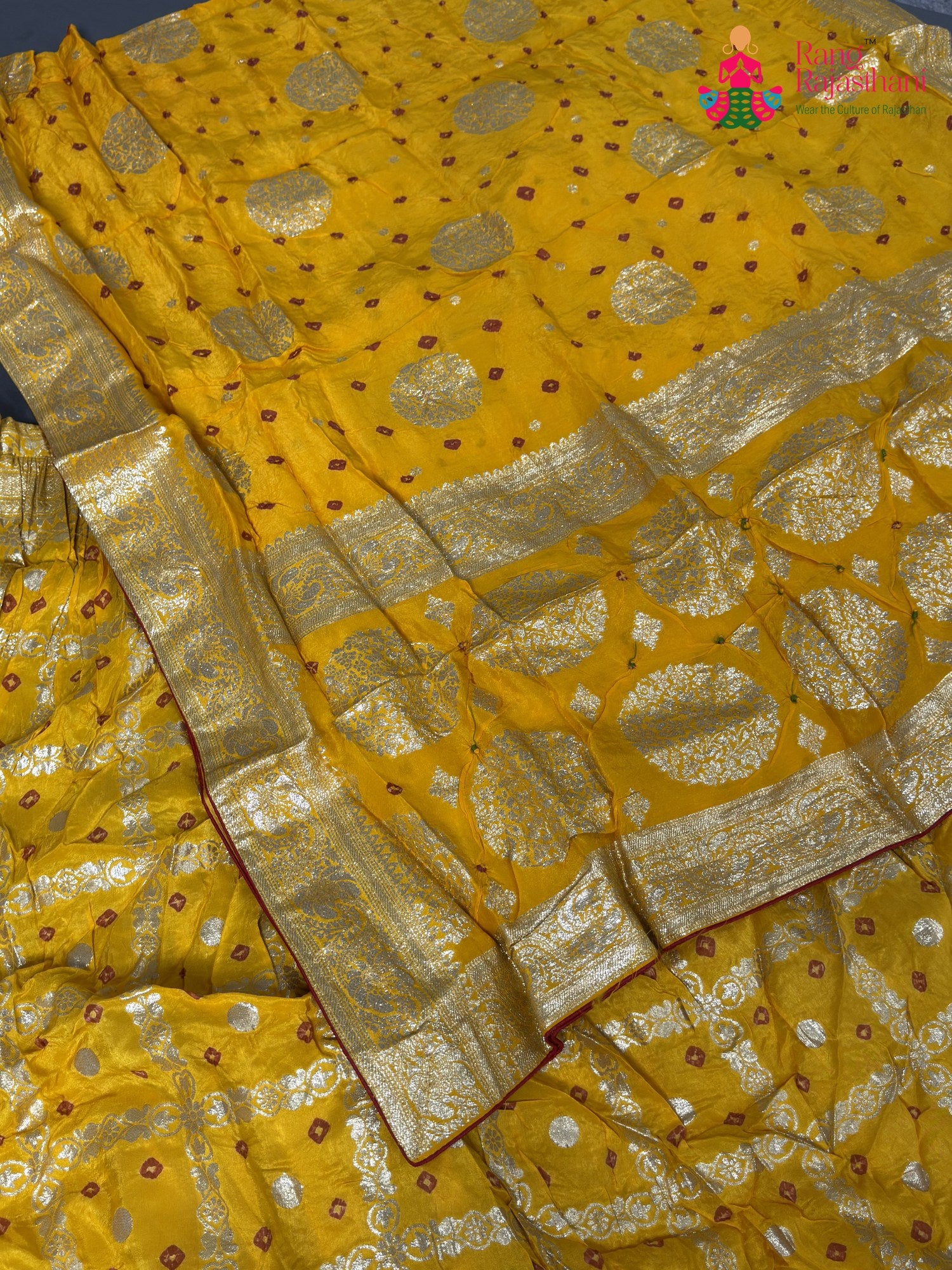 border detail of yellow silk bandhani saree