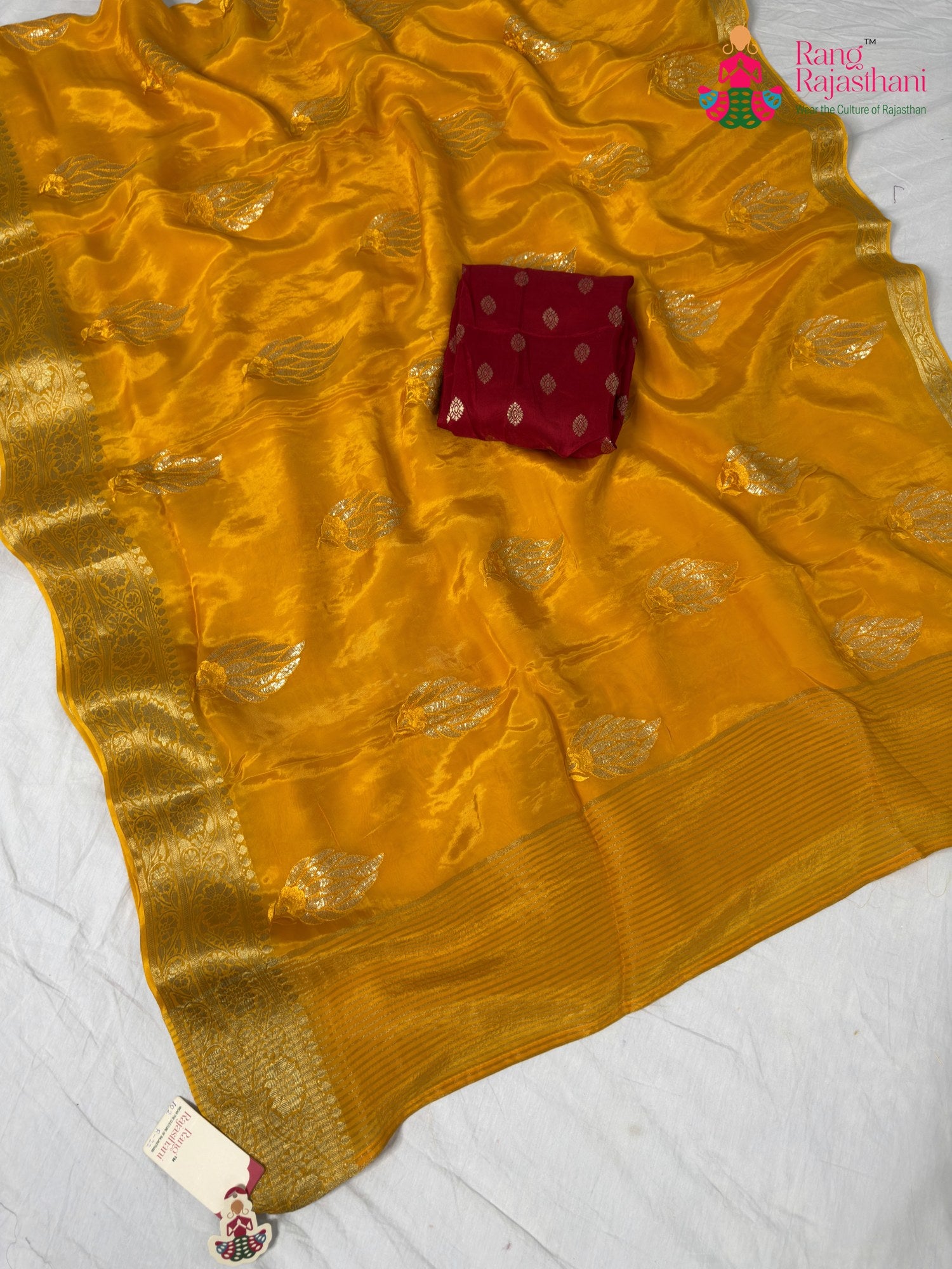 border detailing of yellow silk saree
