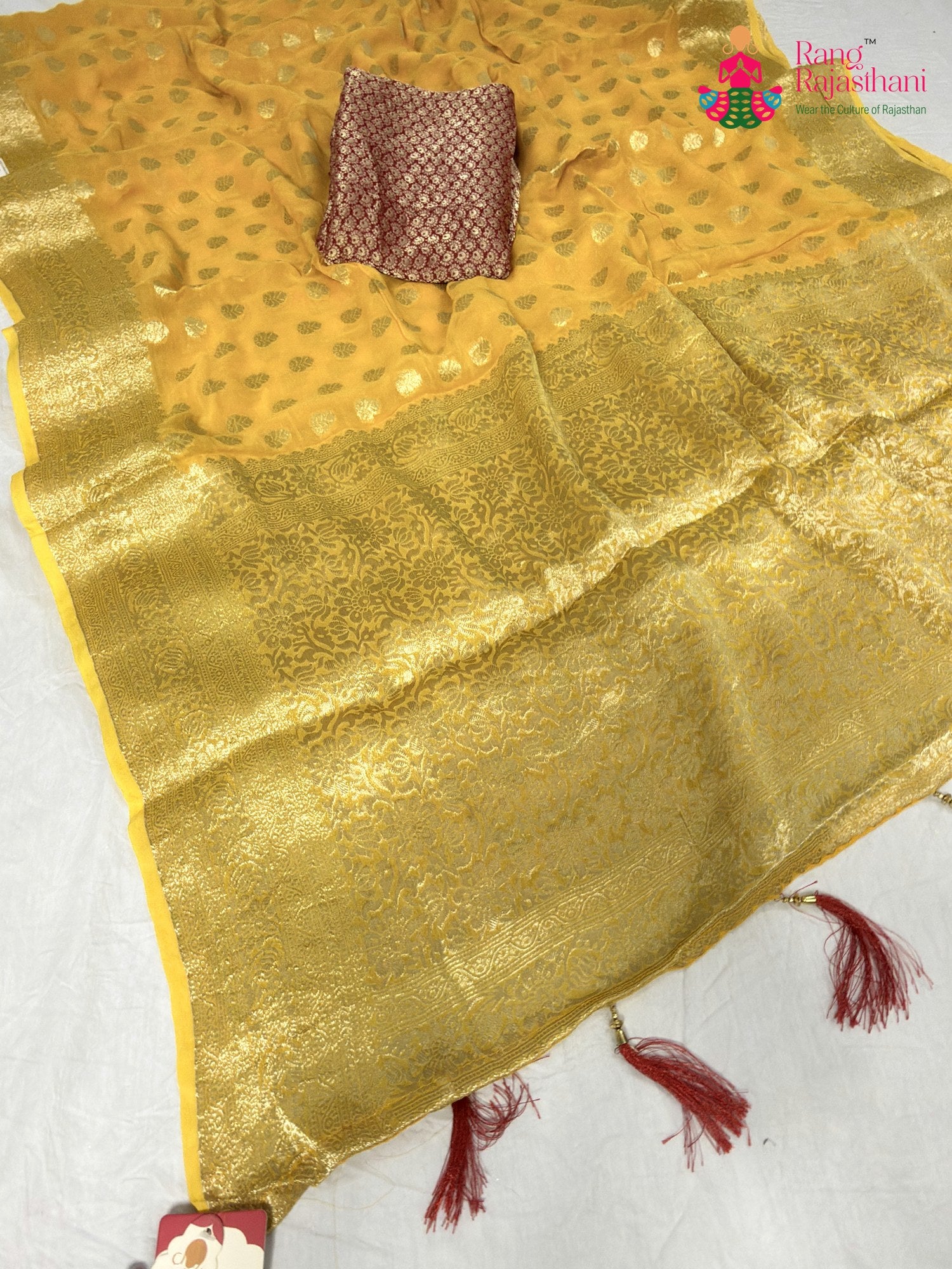 pallu detailing of yellow soft georgette banarasi zari weave saree