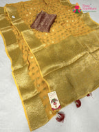 close up detailing of yellow soft georgette banarasi zari weave saree