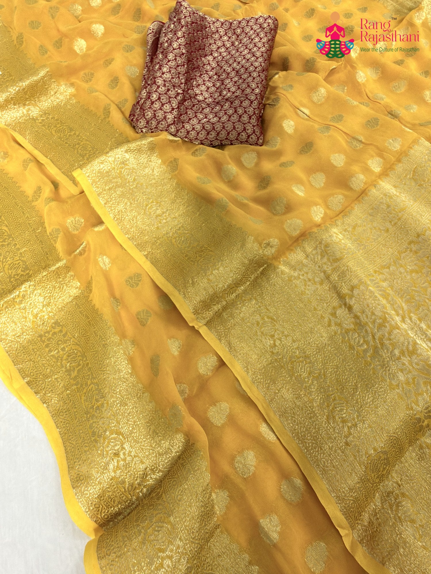 border detailing of yellow soft georgette banarasi zari weave saree