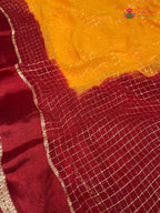 border detail of yellow soft georgette banarasi zari weave saree