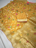 pallu detailing of yellow soft georgette meenakari zari saree