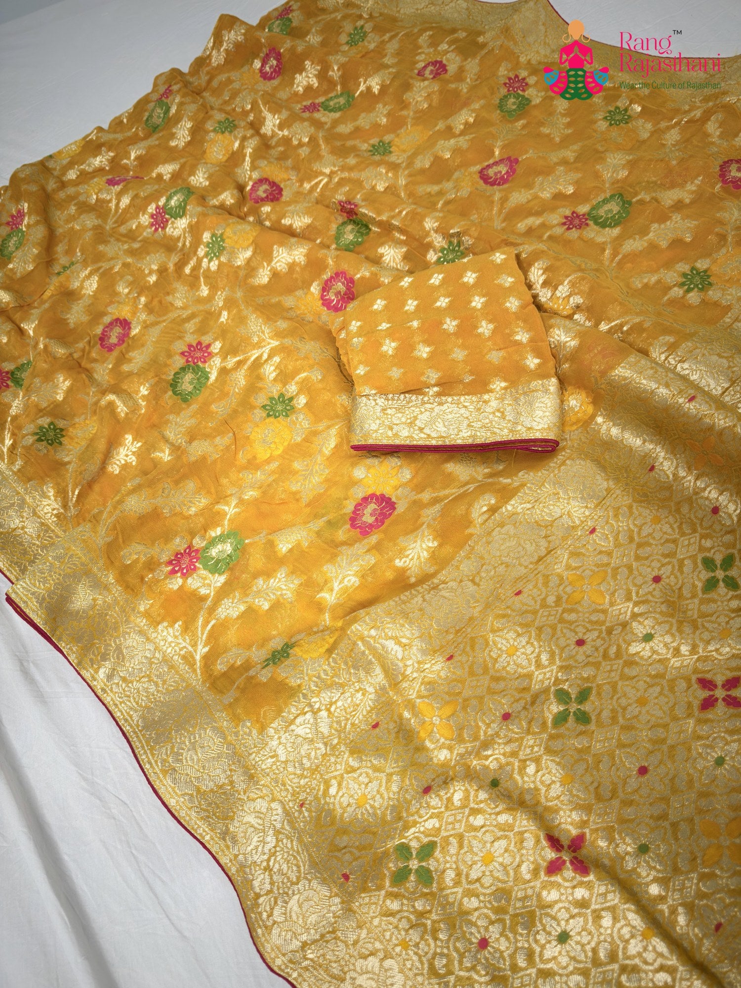 pallu detailing of yellow soft georgette meenakari zari saree