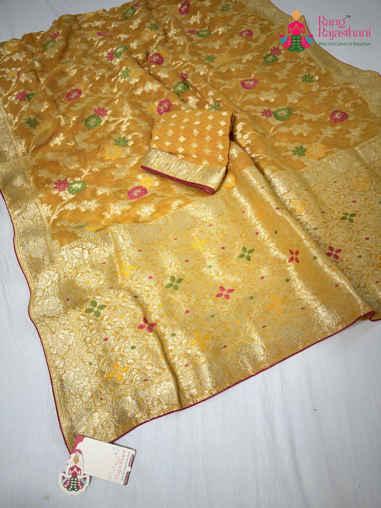 close up detailing of yellow soft georgette meenakari zari saree
