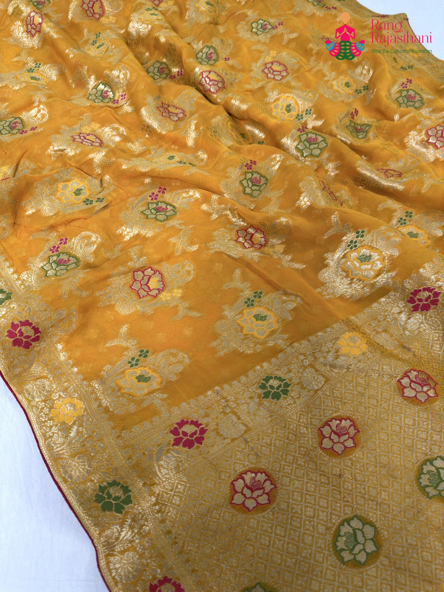 pallu detailing of yellow soft georgette meenakari zari saree
