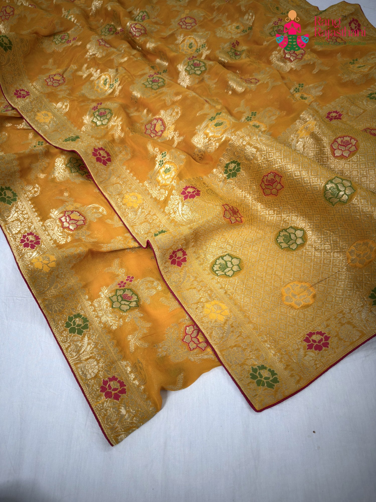 border detailing of yellow soft georgette meenakari zari saree