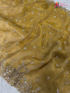 close up detailing of yellow synthetic hand embellishment saree