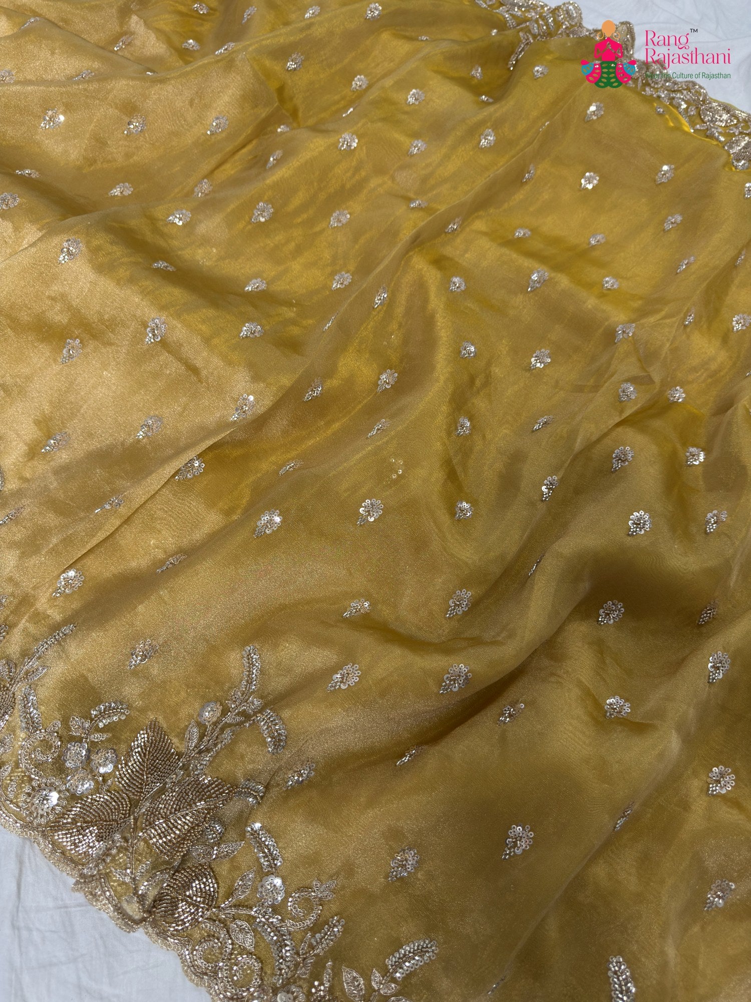 close up detailing of yellow synthetic hand embellishment saree