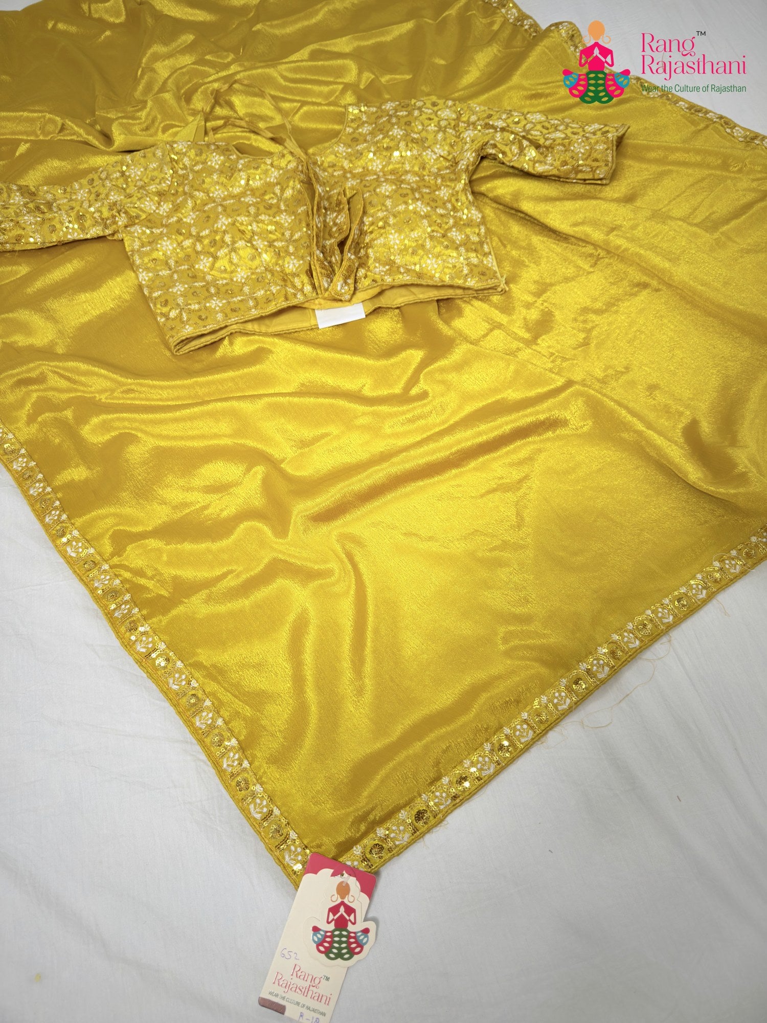 close up detailing of yellow synthetic resham embroidery saree