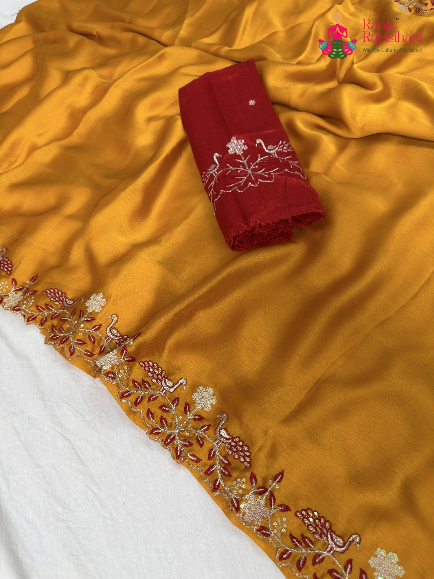 close up detailing of yellow synthetic zari embroidery saree