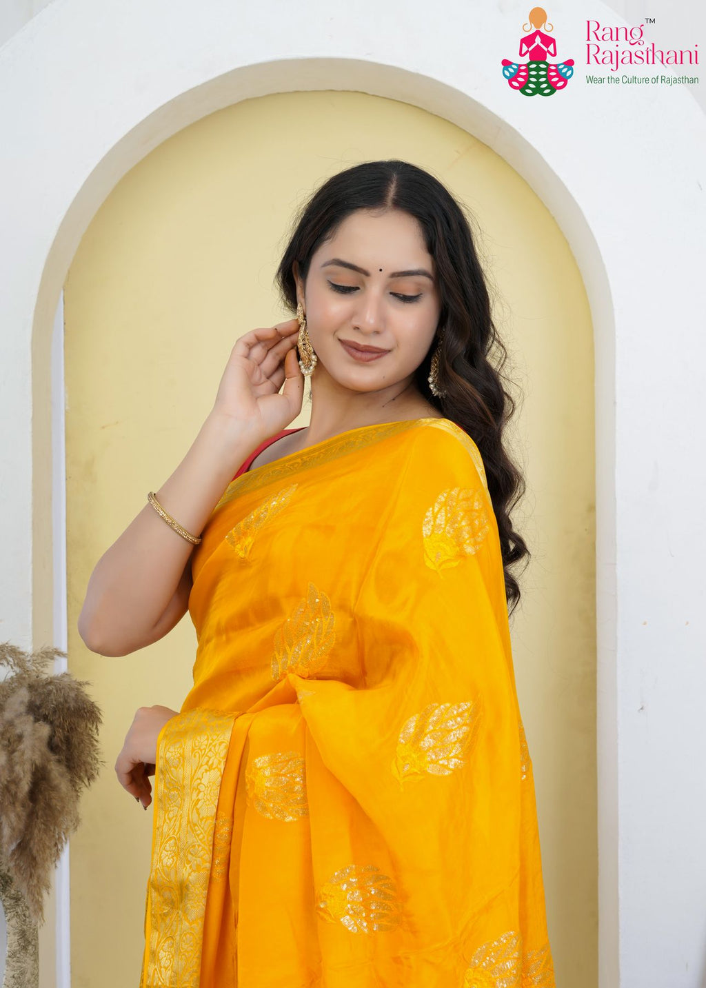yellow silk saree with sequence for mangal path function close-up view