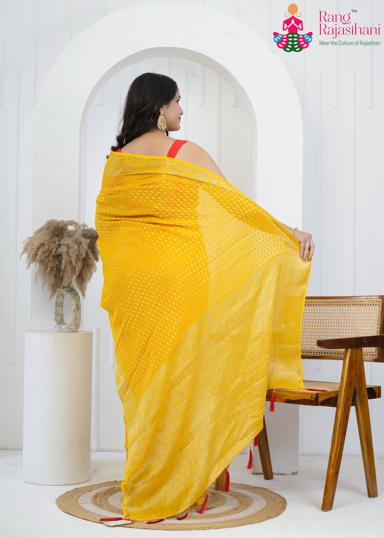 yellow pure georgette saree with khaddi work for baan back view